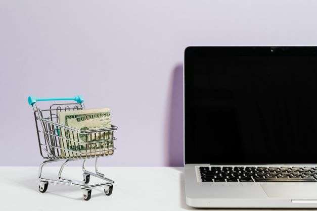 e-commerce-consumer-expectations-and-the-pandemic-shopping-cart-next-to-laptop